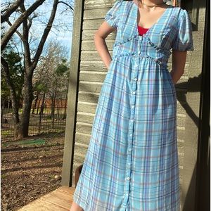 Baby blue plaid button-down dress with puffed sleeves and ruffle detail